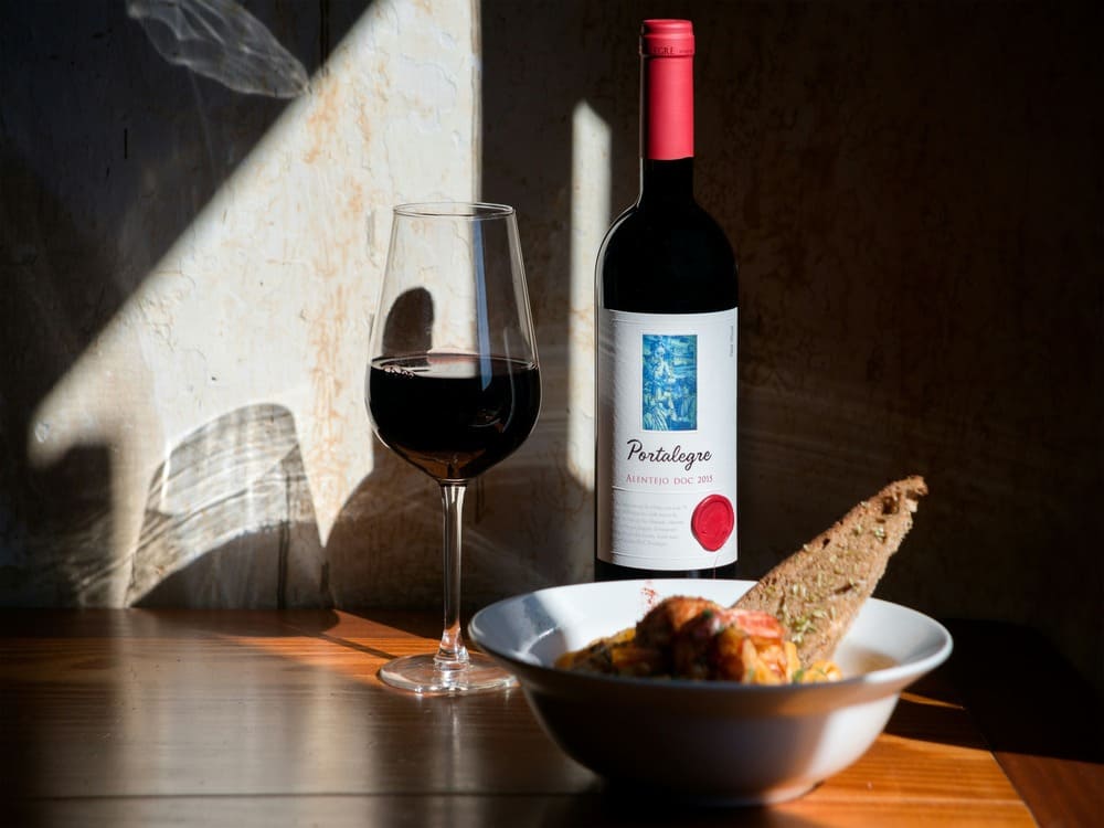 Where to eat in Lisbon traditional Portuguese wine and bread on a table